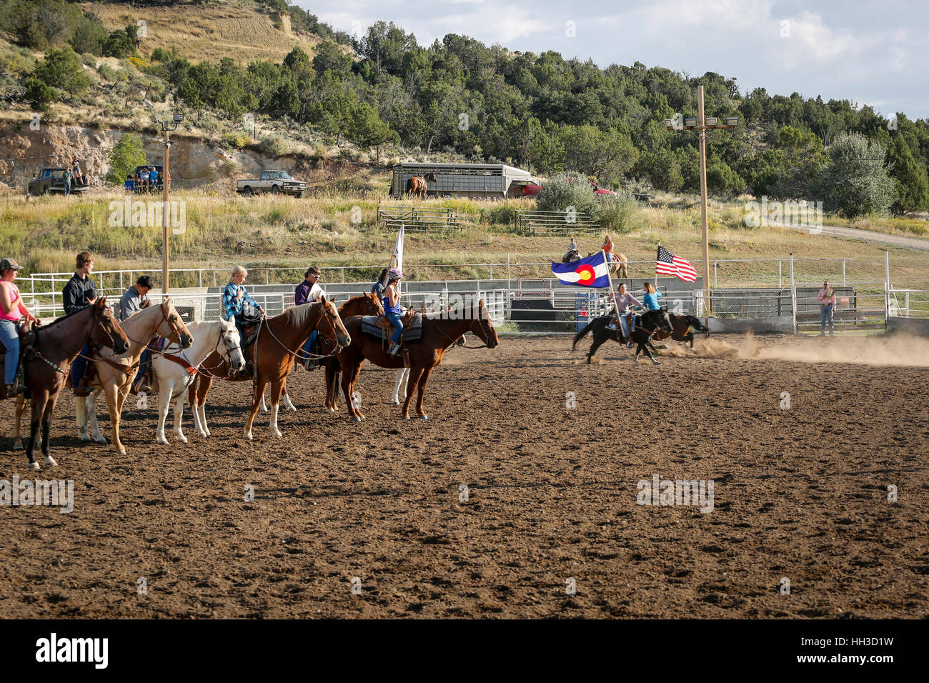Young ladies riding horses and carrying flags during opening ceremonies