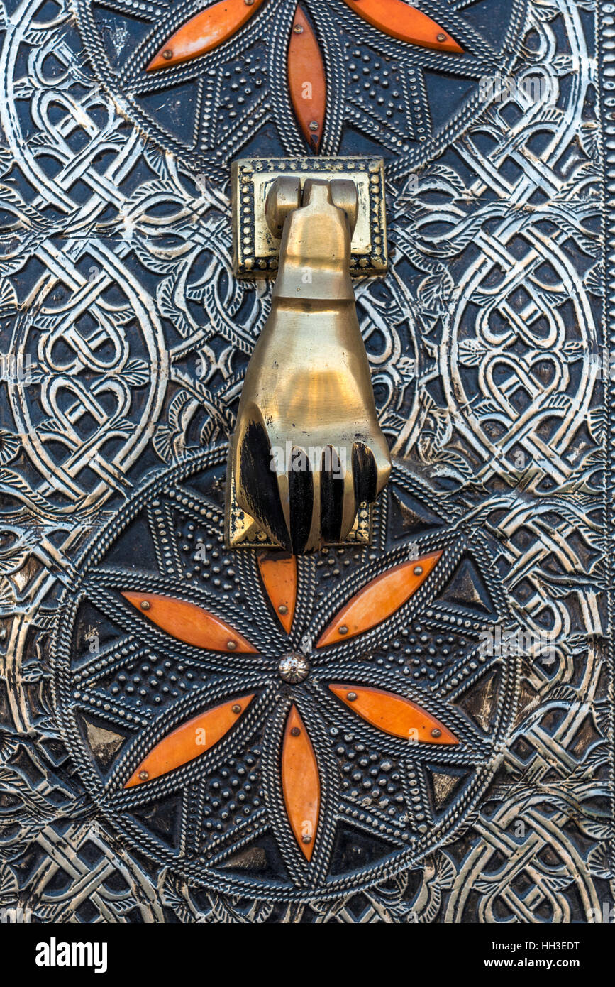 Traditional arabic brass Hamsa door knocker in the shape of a hand Stock Photo