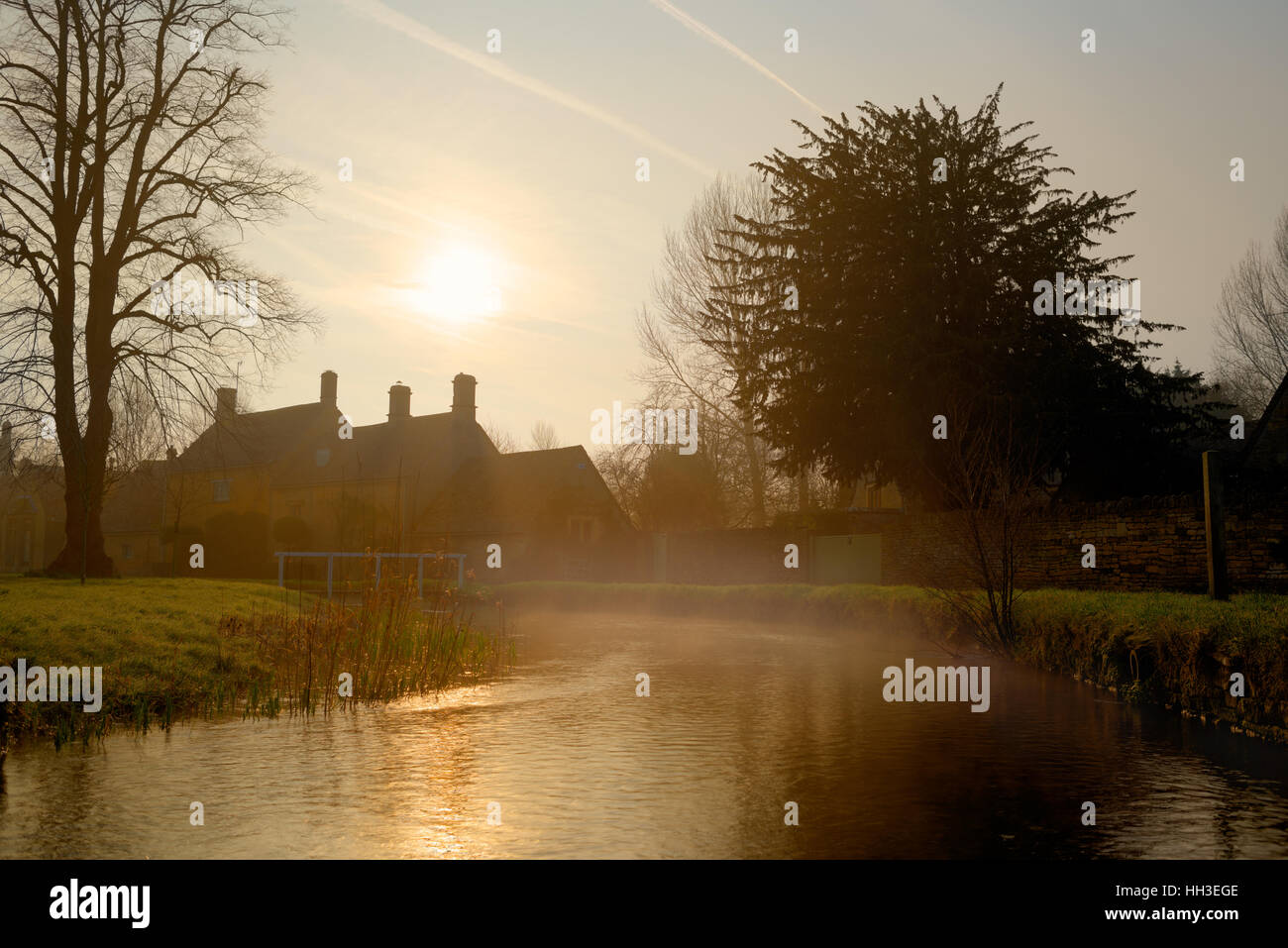 Lower Slaughter village river on a foggy January Morning Stock Photo