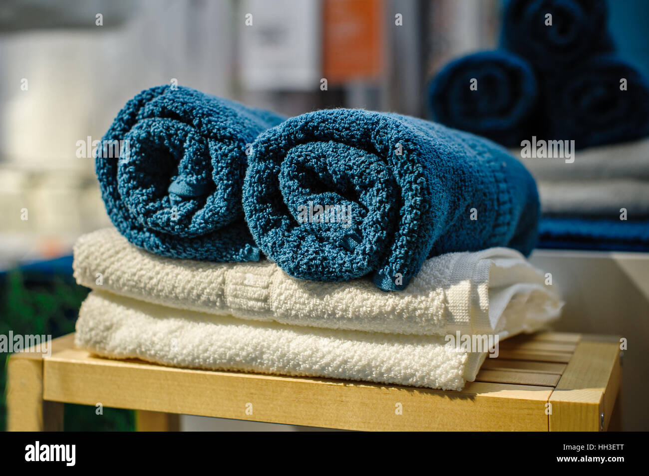 Four clean soft double bath towels set of different colors stacked ...