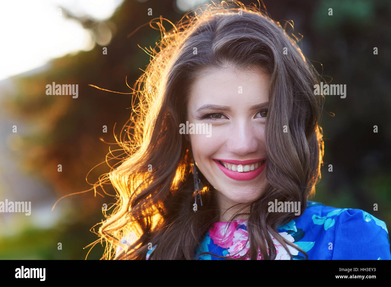 smiling young woman with make-up in the Park Stock Photo