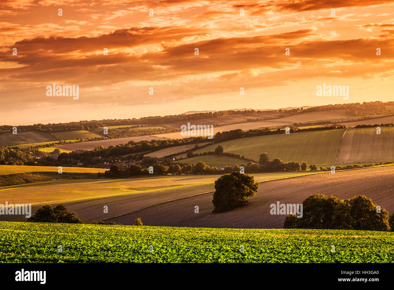 Sunset over the North Wessex Downs in Wiltshire looking over the village of Aldbourne. Stock Photo