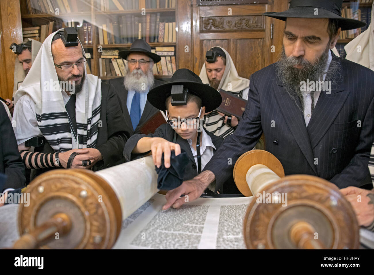 An orthodox religious Jewish boy being called to the Torah for his Bar Mitzvah. In Brooklyn, New York. Stock Photo