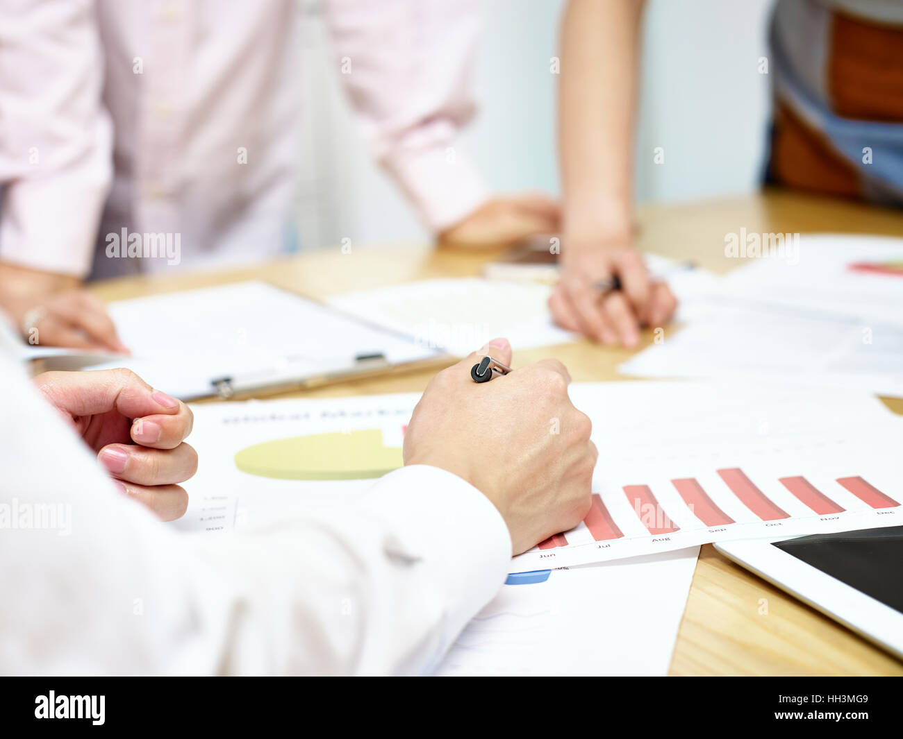 group of people meeting in office discussing business plan. Stock Photo