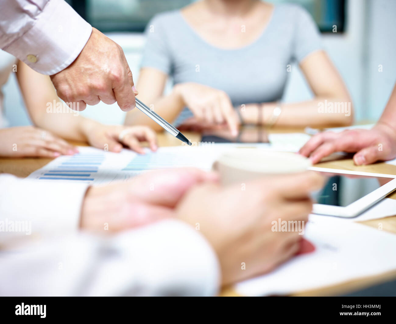 group of asian people meeting in office discussing business plan Stock Photo
