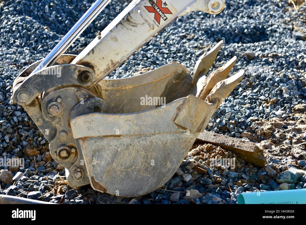 The scoop of a backhoe at a construction site Stock Photo Alamy