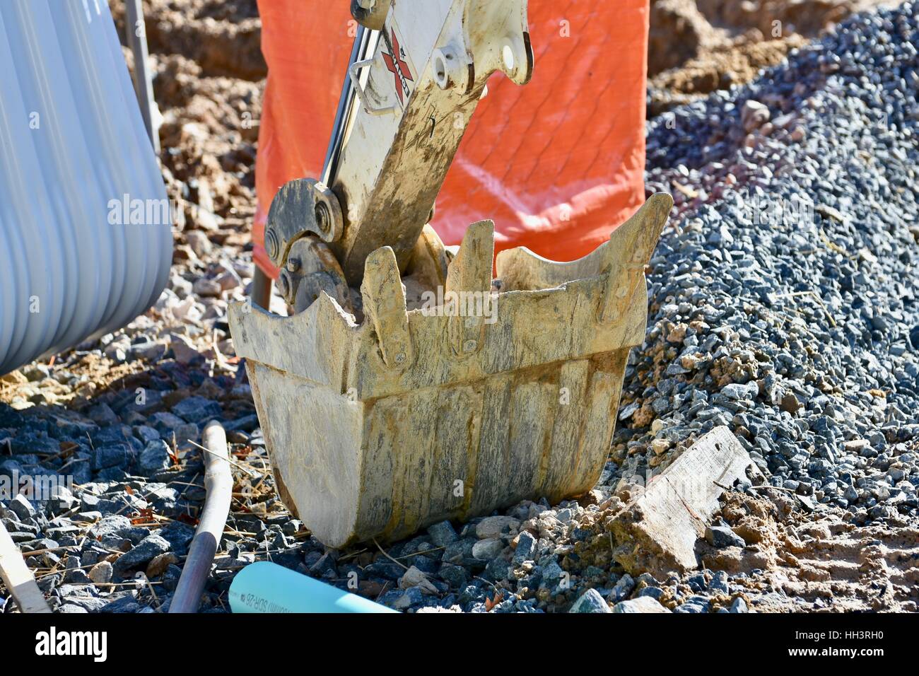 The scoop of a backhoe at a construction site Stock Photo Alamy