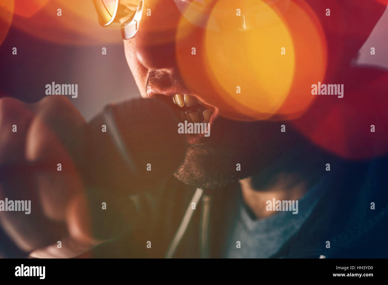 Alternative rock music singer singing song into microphone, bokeh light