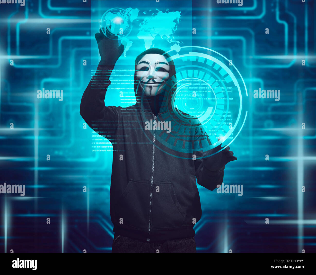 Hooded man with mask using virtual screen to hacking internet system  security Stock Photo - Alamy