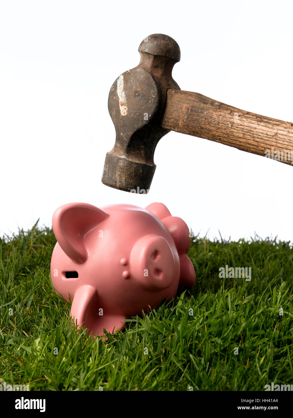 Piggy Bank cracked with a hammer Stock Photo - Alamy
