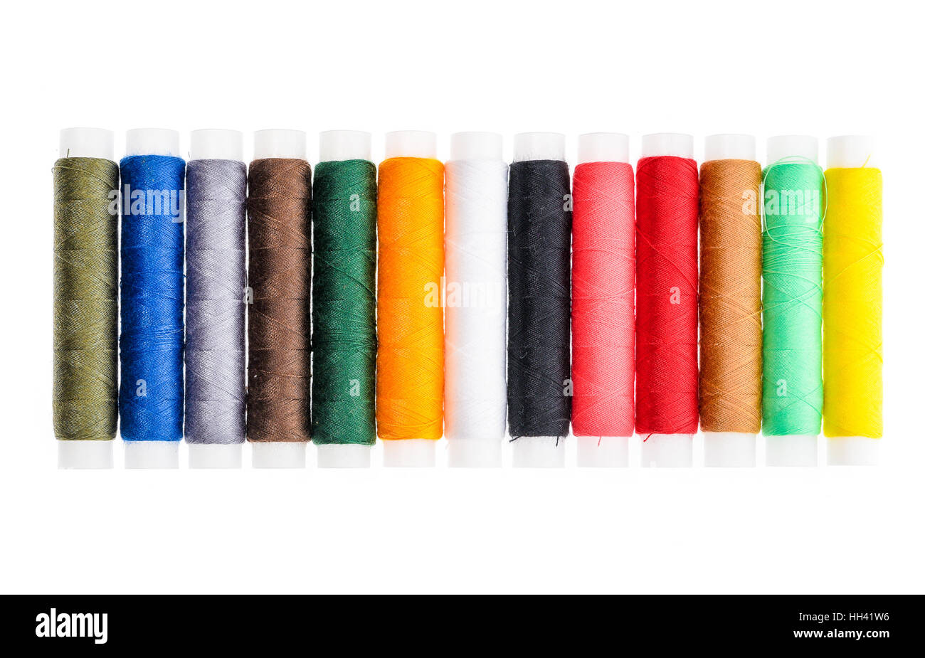 Different color Sewing Threads on a roll. Isolated on white background. Sewing accessories for
