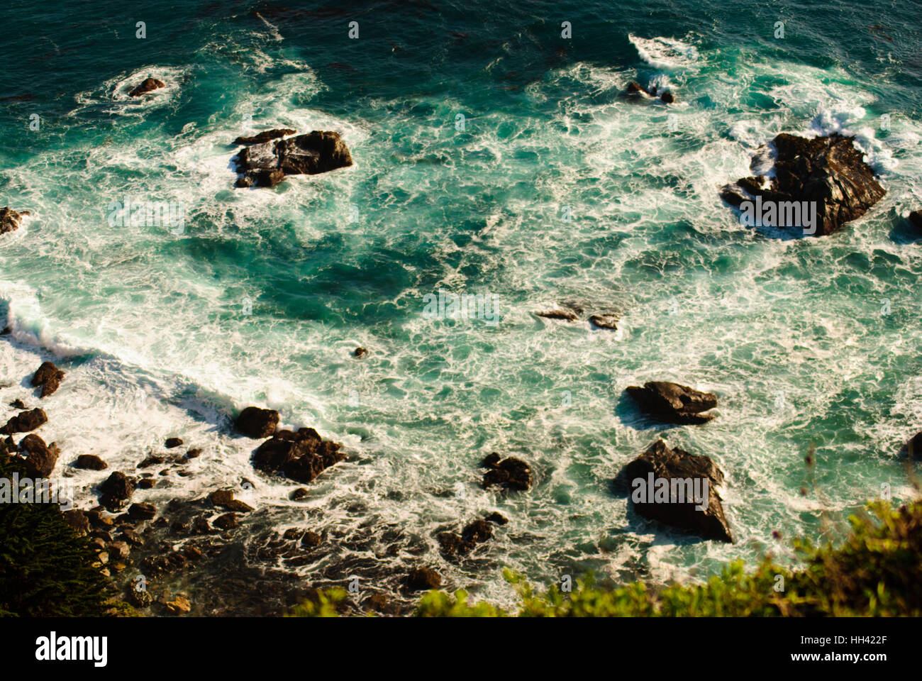 Swirling  waters at the base of a cliff in North Califonia, USA Stock Photo