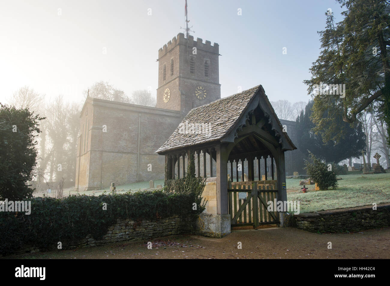 St Nicholas Church in the frost and fog. Tackley, Oxfordshire, England Stock Photo