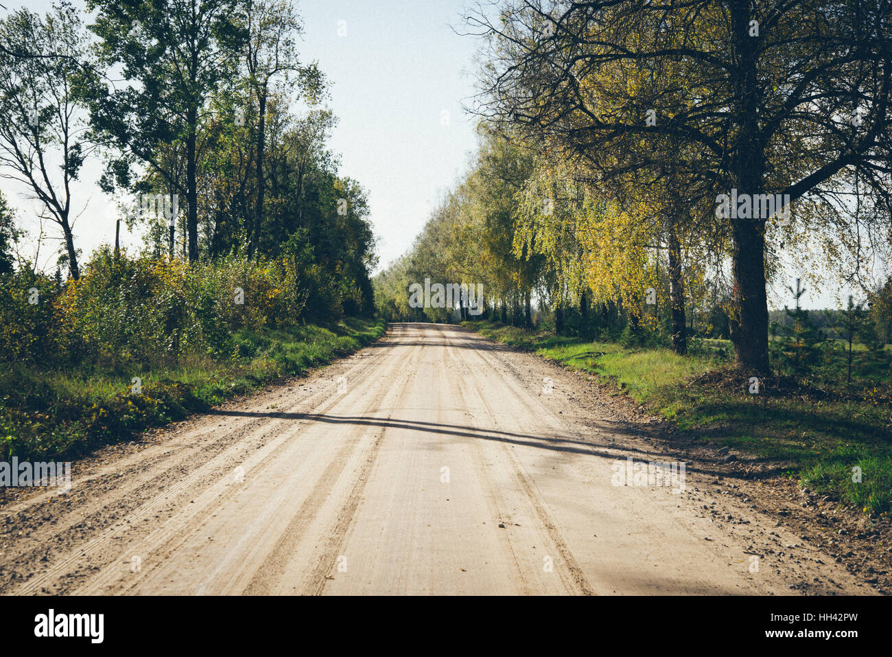 empty country road with perspective Retro grainy color film look. Stock Photo