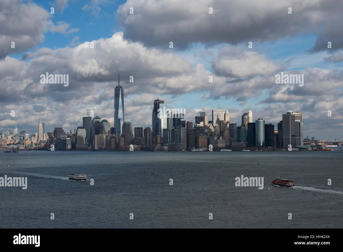 Skyline of New York City. The Financial District of Lower Manhattan in the Upper New York Bay (seen from New York Harbor). USA Stock Photo
