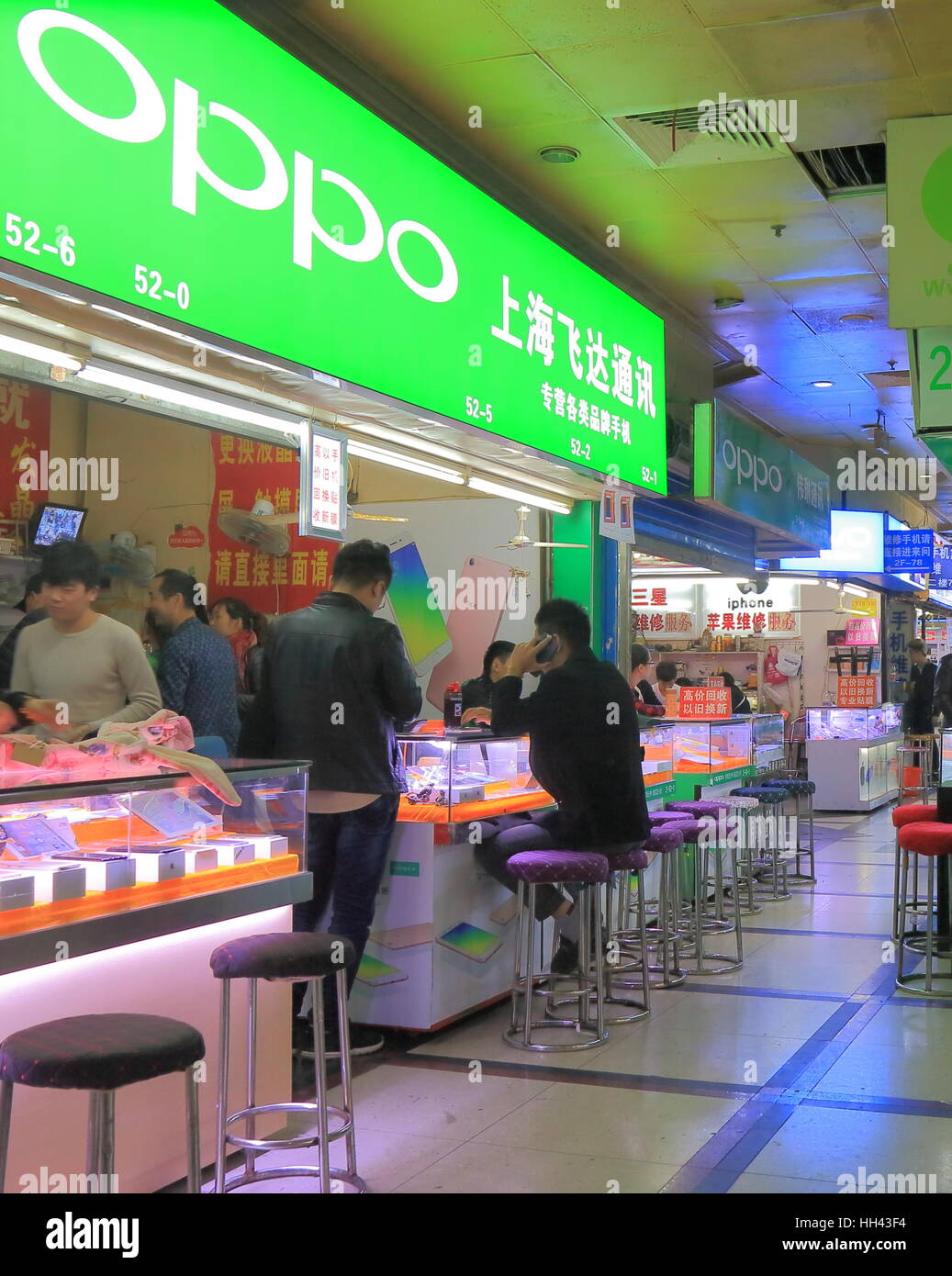 People shop at OPPO mobile phone shop Bu Ye Cheng Commercial market in