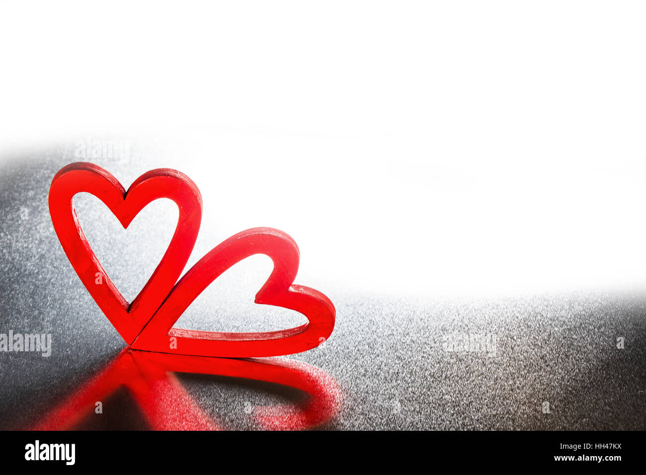 Two red wooden hearts on metal background with copy space Stock Photo ...