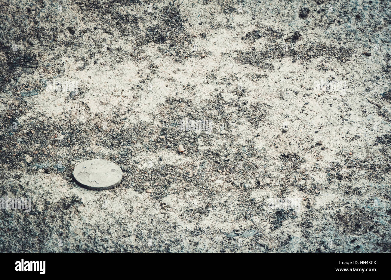 Old coin on ground Stock Photo