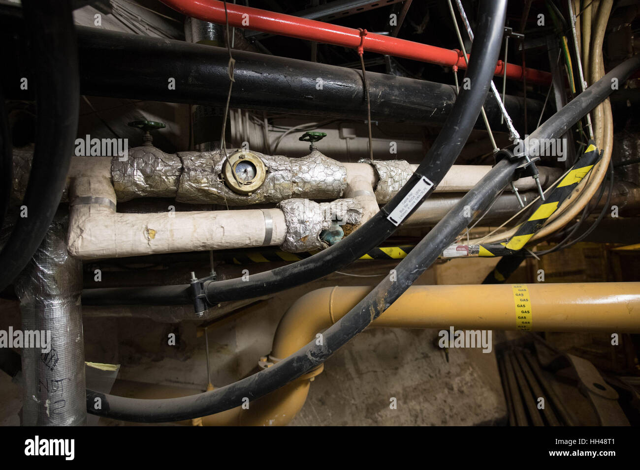 Gas pipes and a mass of cables in the underbelly of the Palace of Westminster, as MPs have been warned that it needs to be evacuated for multibillion-pound emergency repairs if it is to avoid the increasing risk of being ravaged by fire or swamped in a sewerage flood. Stock Photo