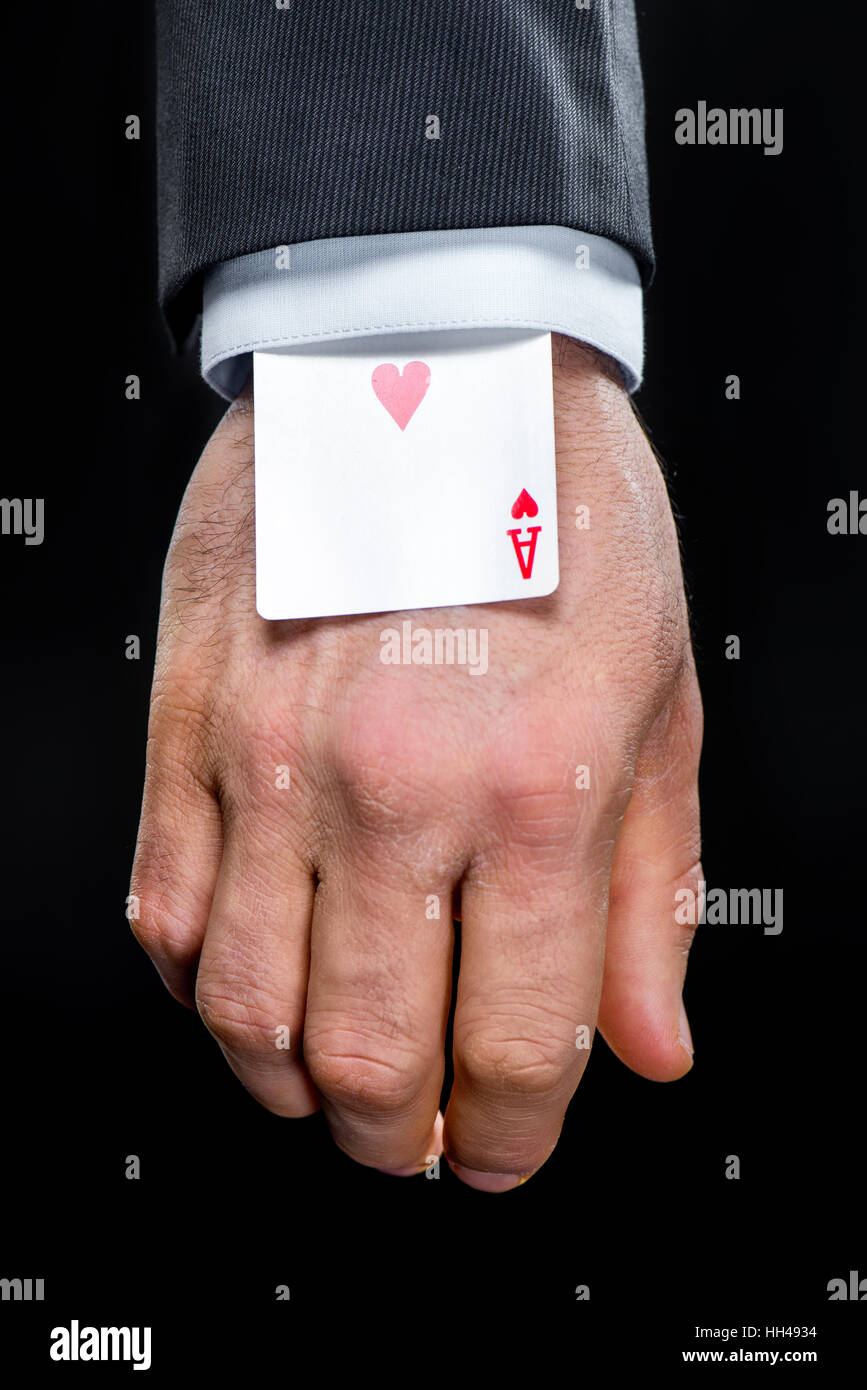 Ace of hearts playing card hidden in sleeve Stock Photo