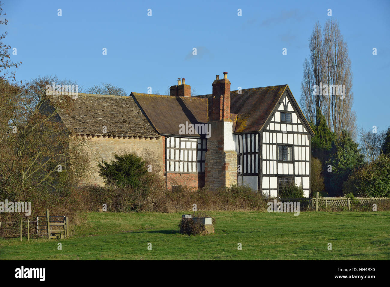 9th century Odda's Chapel & 17th century Timber Framed Abbot's Court Deerhurst, Gloucestershire Stock Photo