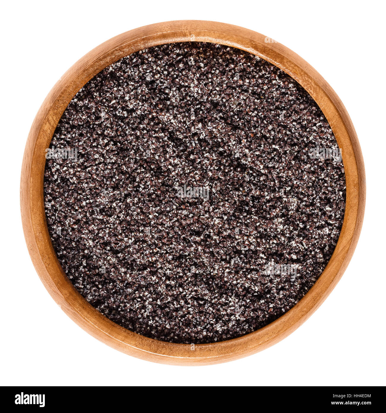 Ground gray poppy seeds in wooden bowl. Oilseed from opium poppy Paper somniferum, used as an ingredient in many foods. Stock Photo