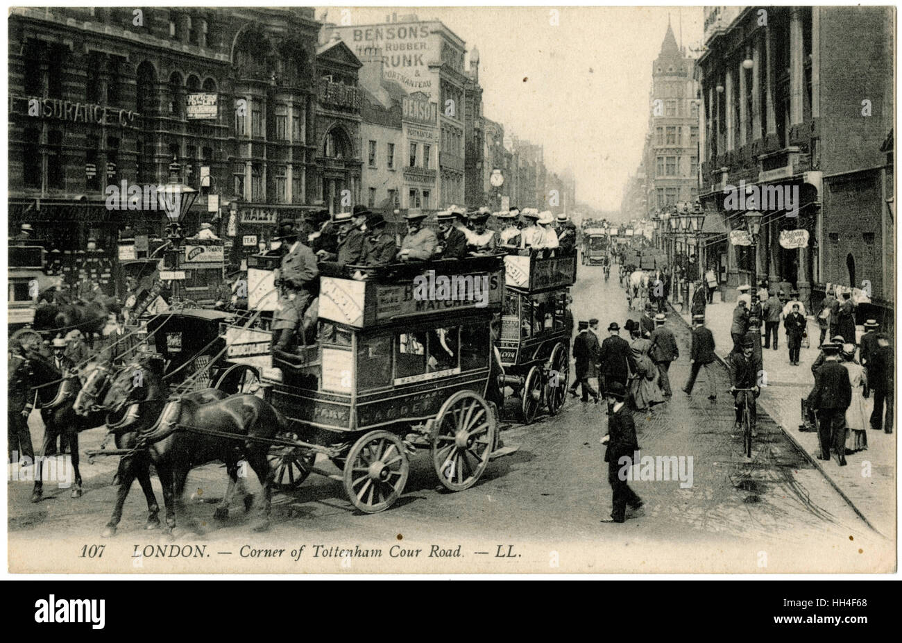 A fantastic postcard image showing traffic on the corner of Tottenham Court Road, London - a number of Horse Buses make the (undoubtedly rather bumpy) turn! Stock Photo