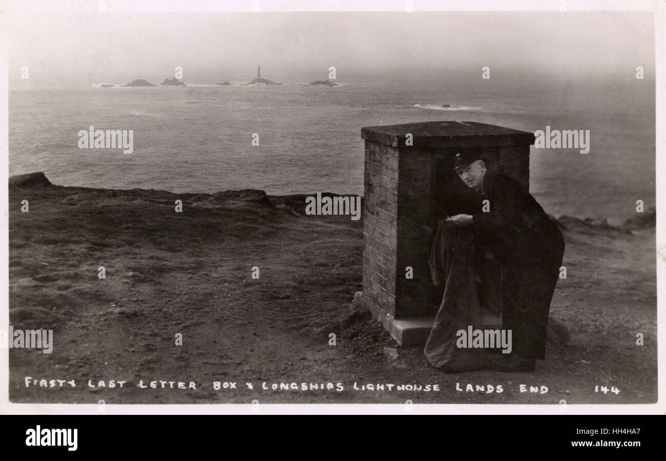 First and last postbox, Land's End, Cornwall, with Longships Lighthouse in the distance. Stock Photo
