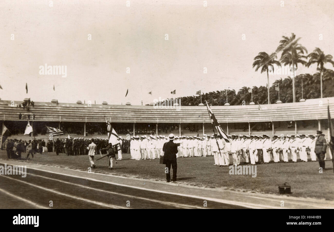 Royal Navy personnel from the warships HMS Hood and HMS Repulse at the Laranjeiras Stadium (football ground of Fluminense FC), Rio de Janeiro, Brazil. They were there for the Goodwill Olympics, September 1922. Also participating were personnel of the Amer Stock Photo