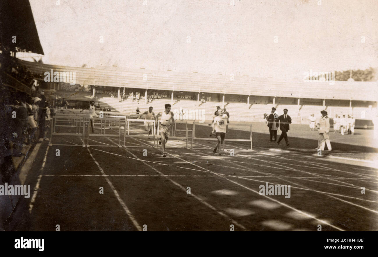 Royal Navy personnel from the warships HMS Hood and HMS Repulse competing in a hurdles event at the Laranjeiras Stadium (football ground of Fluminense FC), Rio de Janeiro, Brazil. They were there for the Goodwill Olympics, September 1922. Stock Photo
