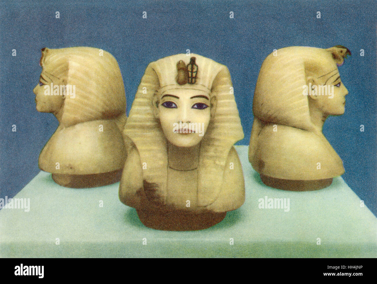 Three Alabaster heads portraying Tutankhamun (reigned 1332–1323 BC) from his tomb, as discovered by Howard Carter among others in 1922 in the Valley of Kings. The heads served as lids for the compartments of the canopic chest which contained the king's vi Stock Photo