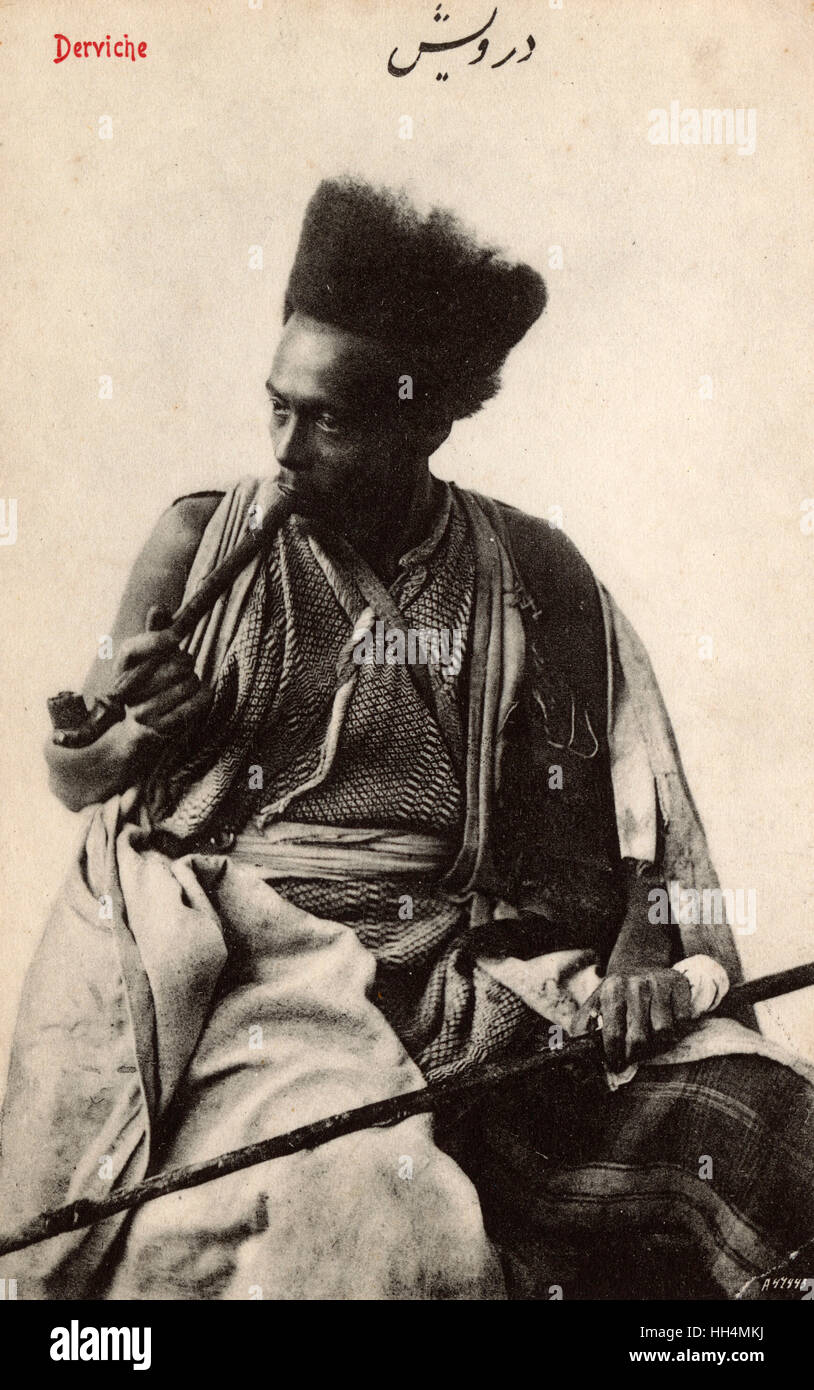 Pipe-smoking Syrian Dervish with fantastic hairstyle. Dervish or Darvesh in Persian usually refers to a person who is a ‘seeker of the truth’ i.e. ‘ universal truth’. Within the Islamic tradition such people are often known as Sufis, Sufi, ‘people of the Stock Photo
