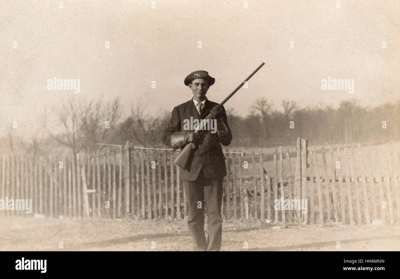 Man posing with rifle Stock Photo