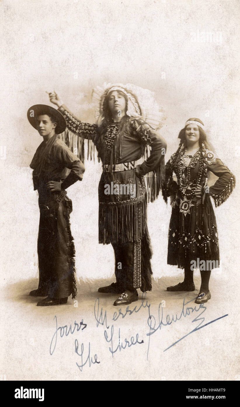 Three people in Cowboy and Indian costume in studio photo Stock Photo