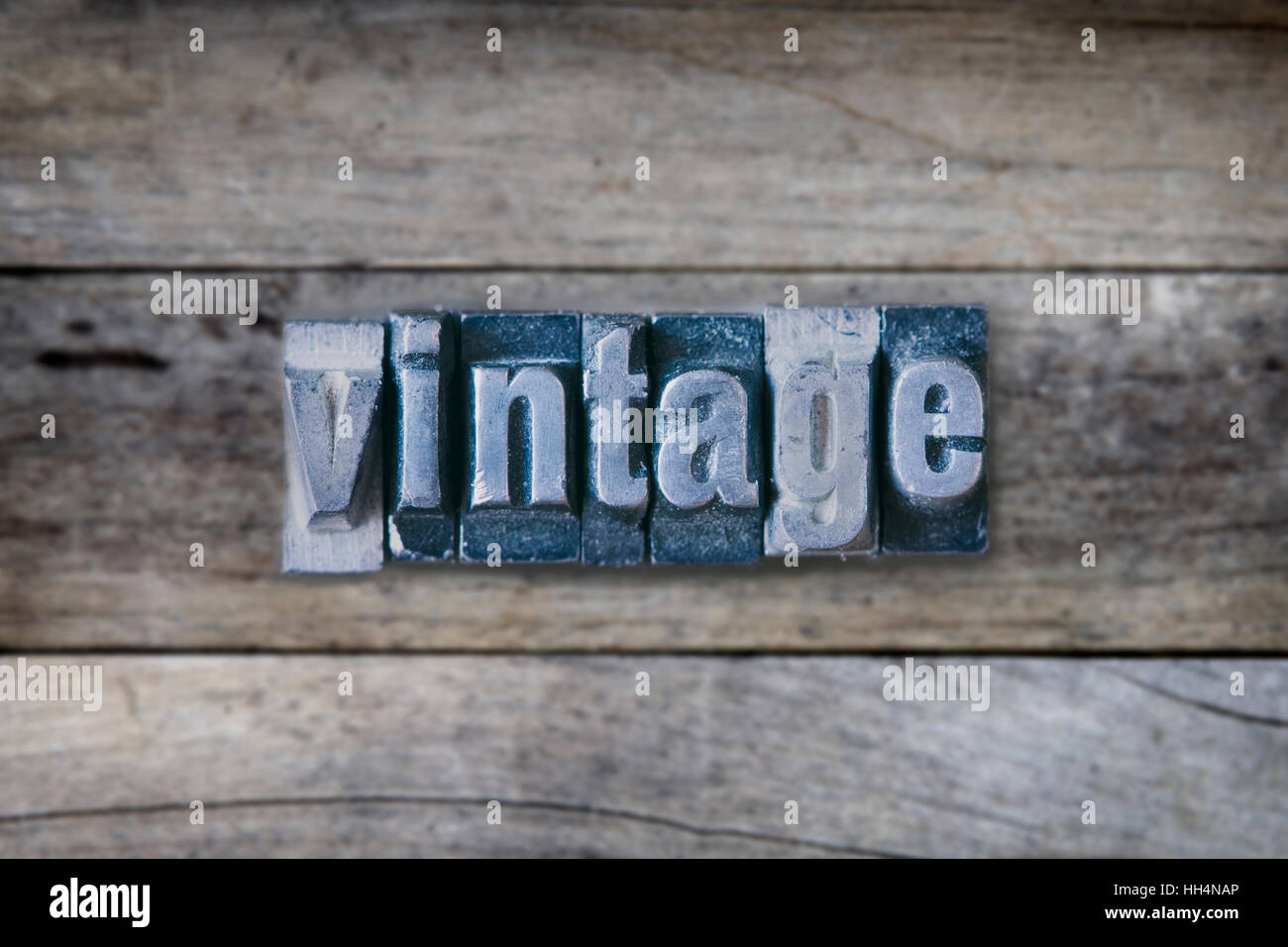 Vintage word made with typewriter printing letters on wooden table