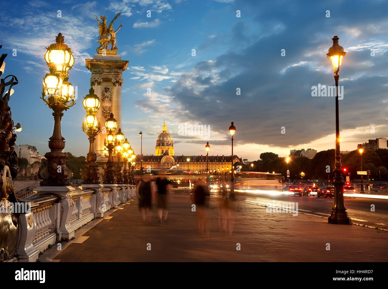 View on Les Invalides from bridge Alexandre III in Paris at sunset, France Stock Photo