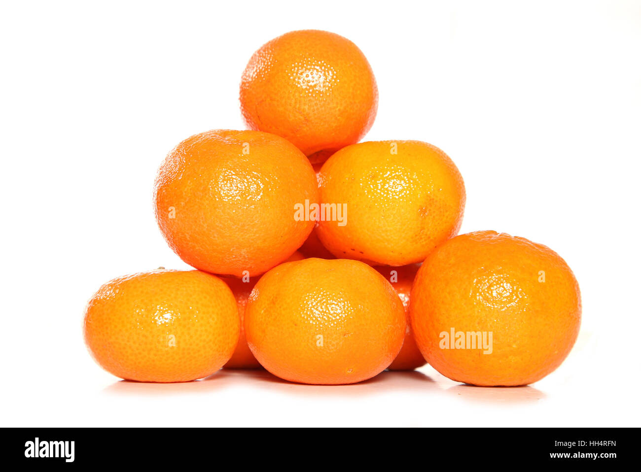 pile of clementine fruit in a studio with isolated cutout Stock Photo