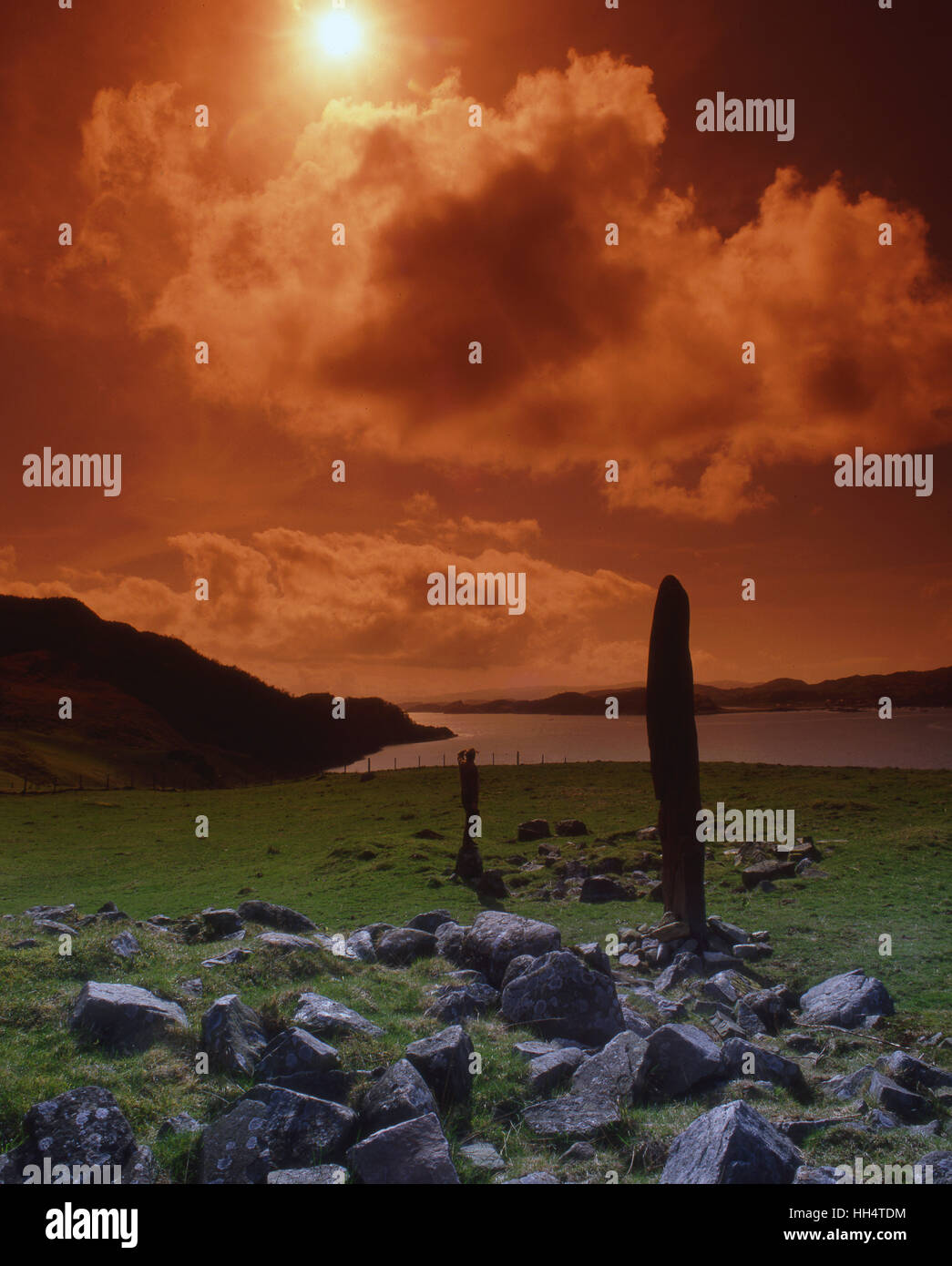 Sunset over the standing stone above Loch Craignish, N/W Highlands. Stock Photo