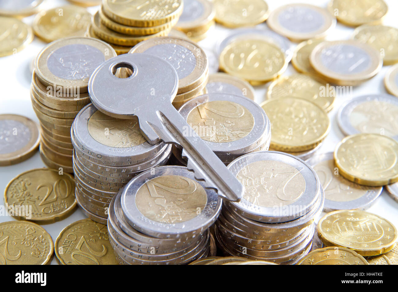 Euro coins with key Stock Photo