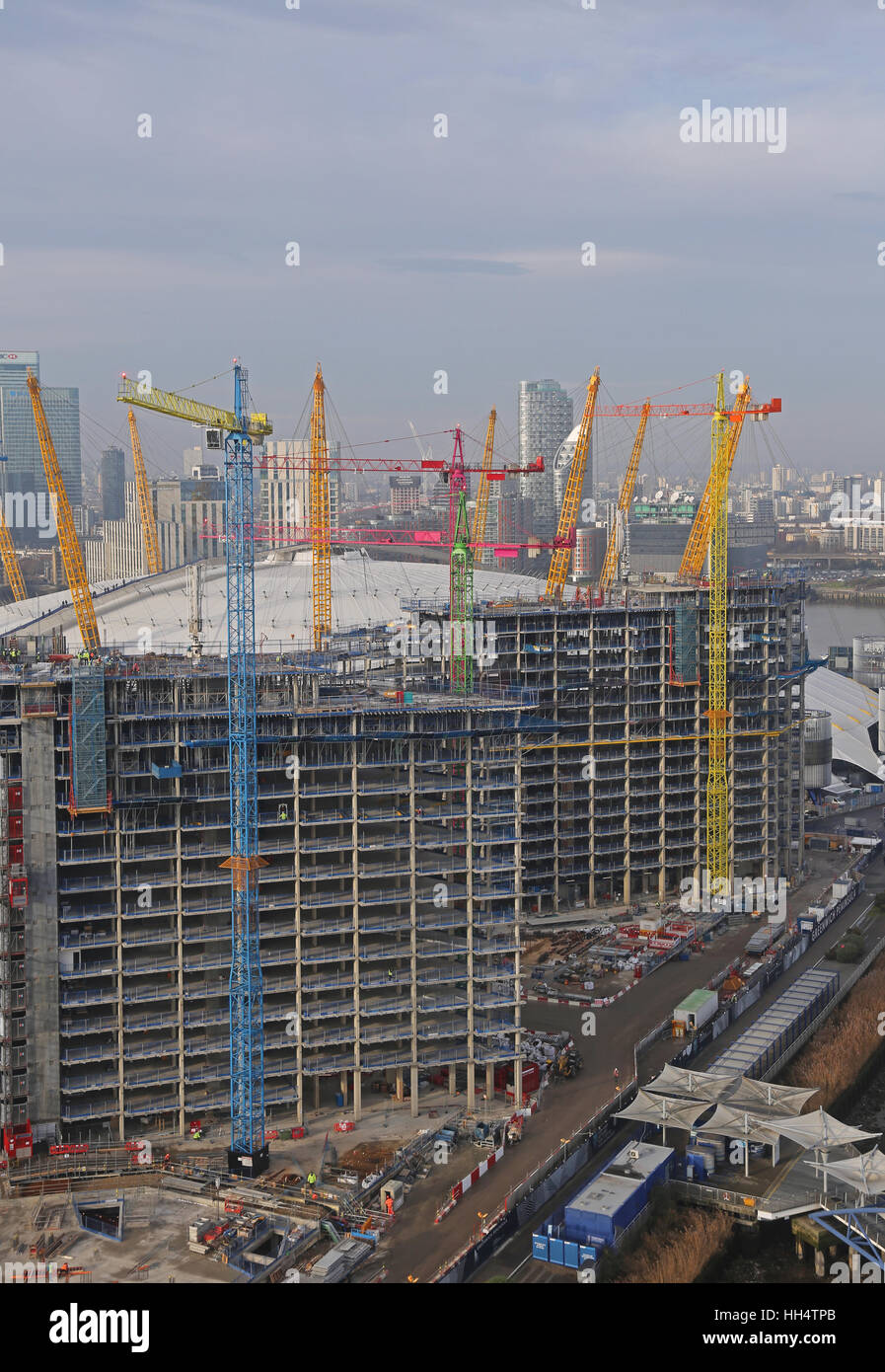 Multi-coloured tower cranes in use during the construction of a major residential development on London's Greenwich Peninsular Stock Photo