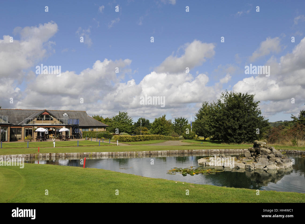 View of the 18th Green with the Clubhouse and terrace in the background, Bletchingley Golf Club Surrey England Stock Photo