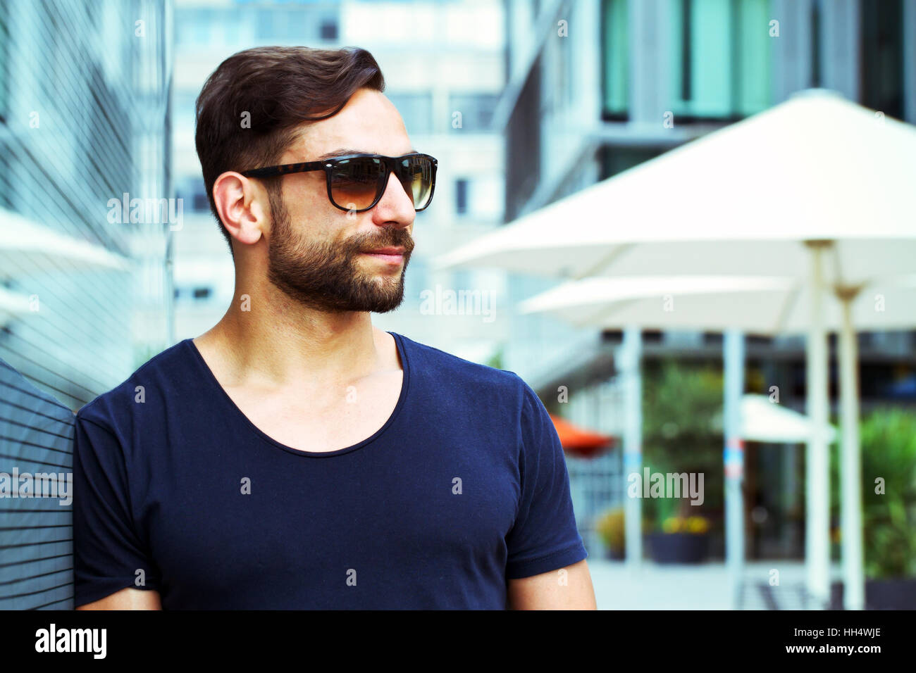 Portrait of a modern man with sunglasses in the city Stock Photo