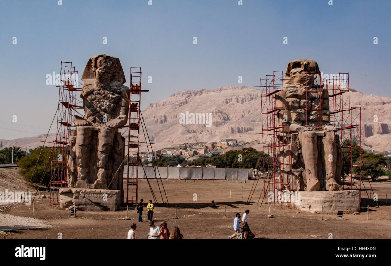 Colossi of Memnon are two massive stone statues of the Pharaoh Amenhotep III, who reigned in Egypt during Dynasty under repair. Stock Photo