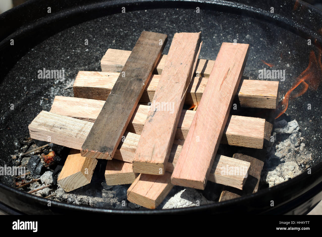 Burning kindling in portable barbecue Stock Photo Alamy