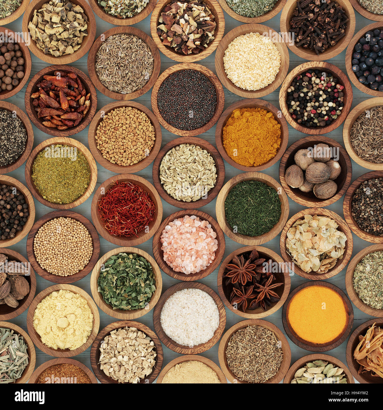 Herb and spice seasoning in wooden bowls, high in antioxidants and