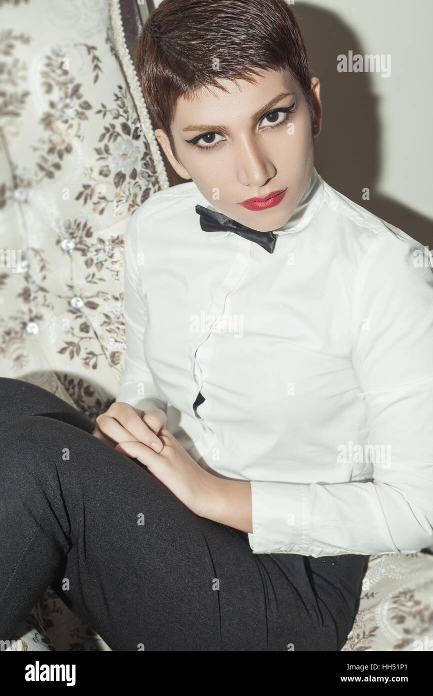 Young Beautiful Woman With Short Hair Style And Classic Wear With