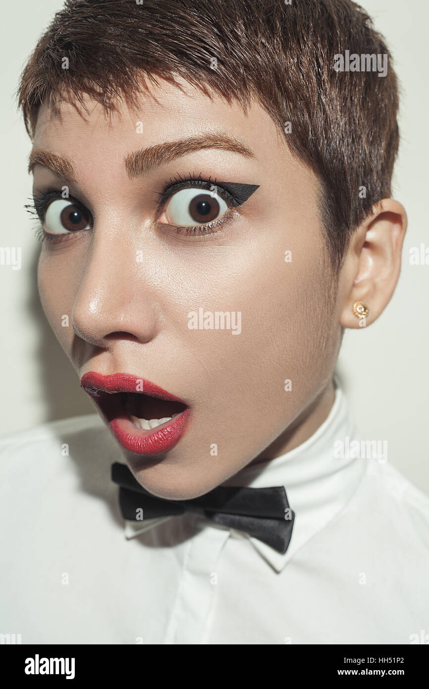 young beautiful woman with short hair style and classic wear with bow tie  Stock Photo - Alamy