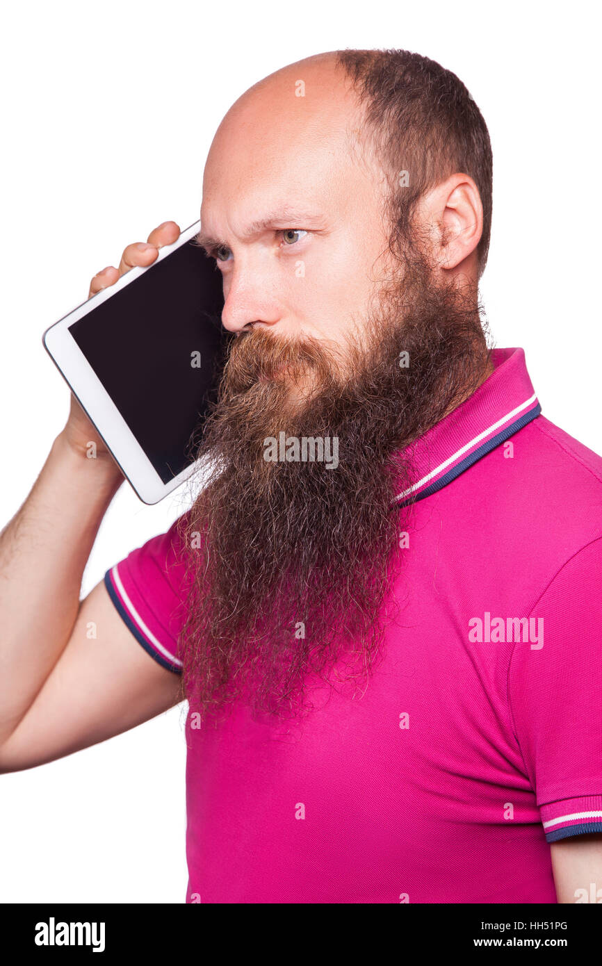 portrait of bald bearded man with tablet and pink t-shirt isolated on white background. Stock Photo