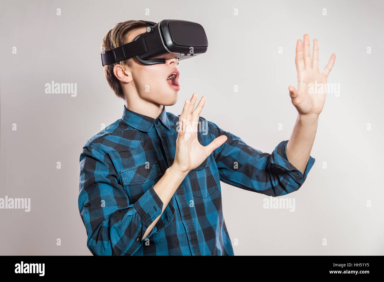 emotional funny man wearing virtual reality goggles. Studio portrait of  video game designer wearing VR headset. studio shot Stock Photo - Alamy
