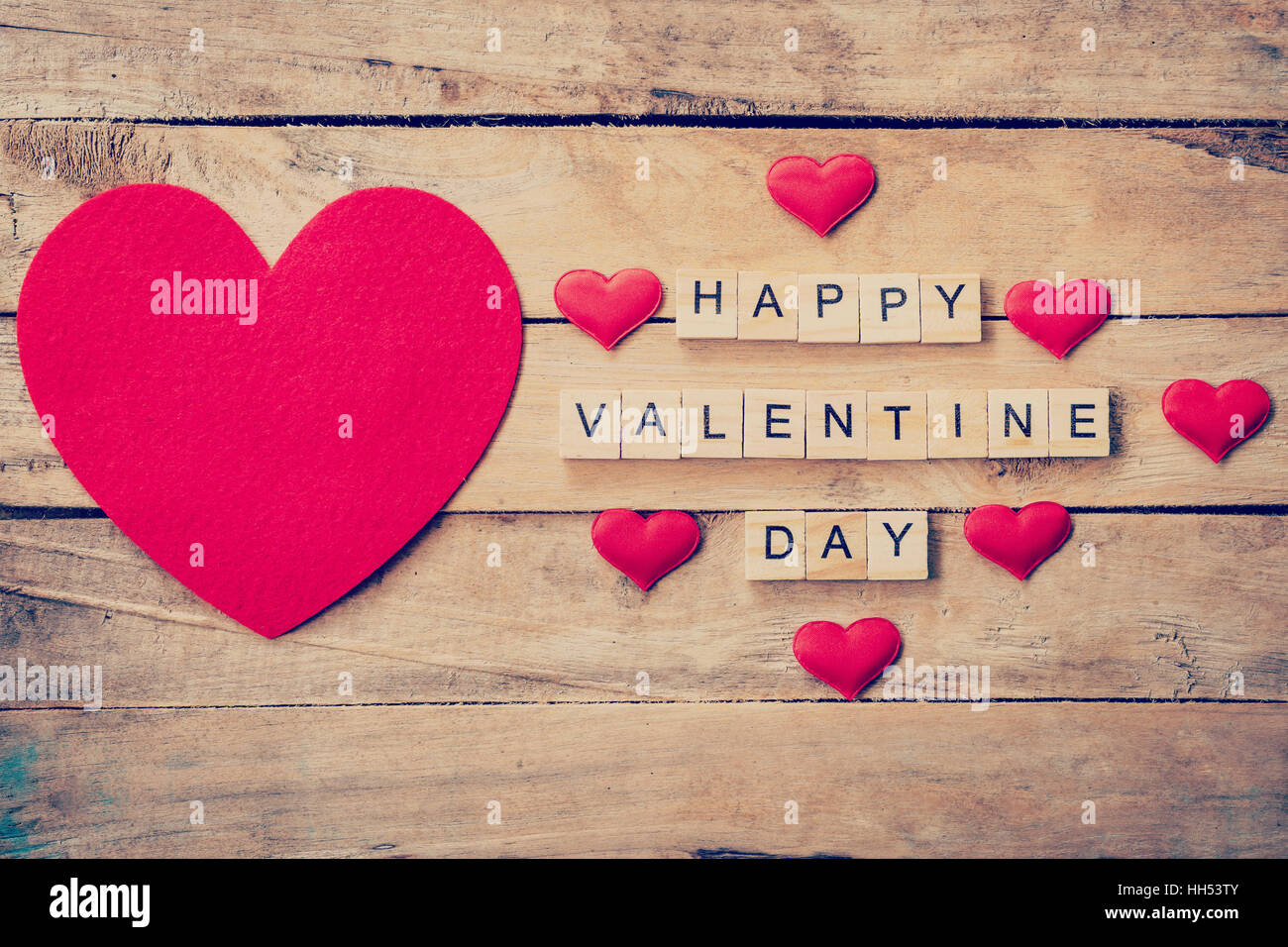 Red heart with wooden text Happy Valentine Day on wood table background ...